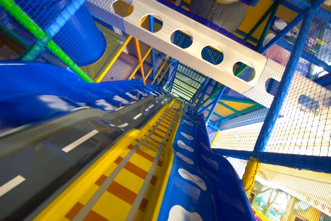 Large 4 lane slide in soft play area of Bubbles World of Play, Merseyside. A large indoor play area for kids in Liverpool region.